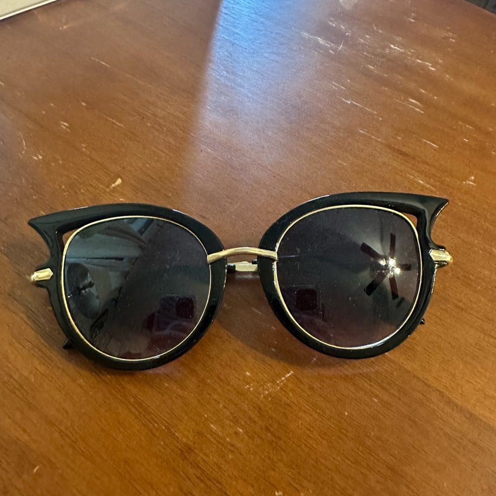 Gold and black cat eye sunglasses